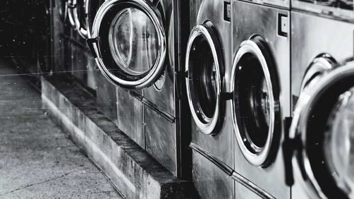 grayscale photography of front load washers
