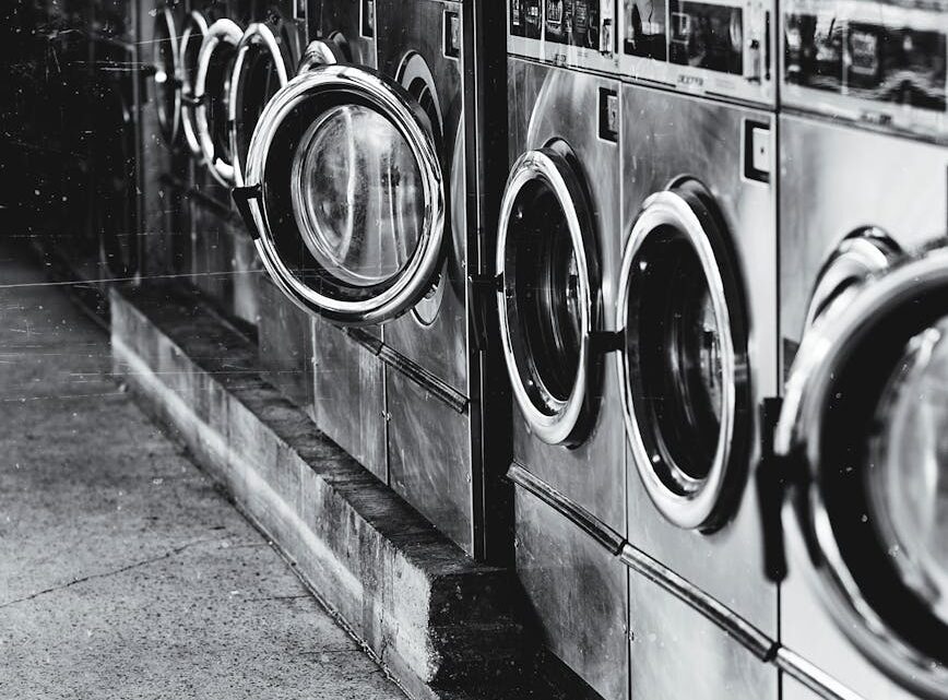 grayscale photography of front load washers